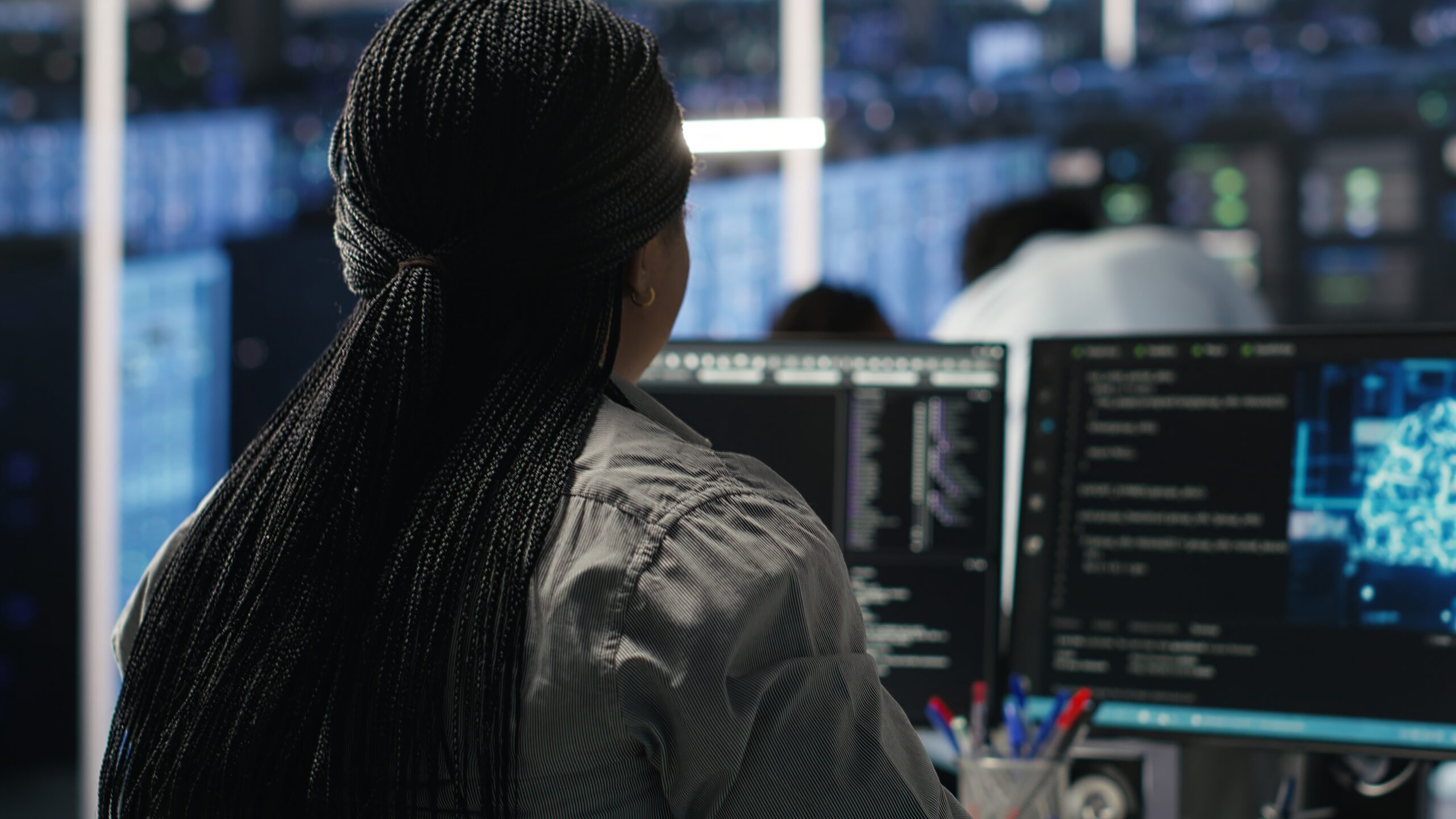 IT staff member works on cyber programming